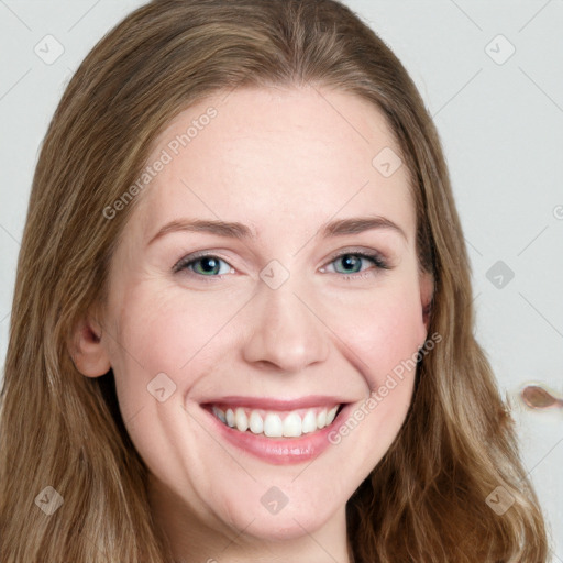 Joyful white young-adult female with long  brown hair and blue eyes