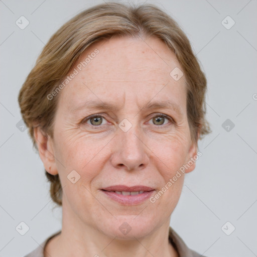 Joyful white adult female with medium  brown hair and grey eyes