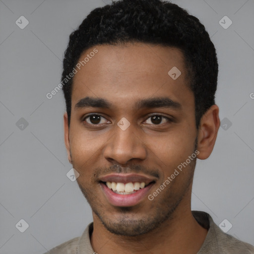 Joyful black young-adult male with short  black hair and brown eyes