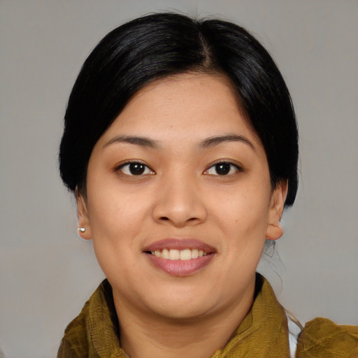 Joyful asian young-adult female with medium  black hair and brown eyes