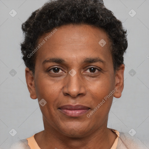 Joyful black adult male with short  brown hair and brown eyes