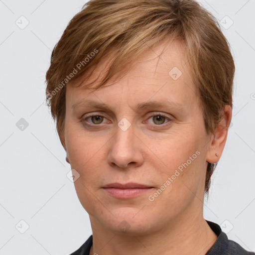 Joyful white adult female with short  brown hair and grey eyes