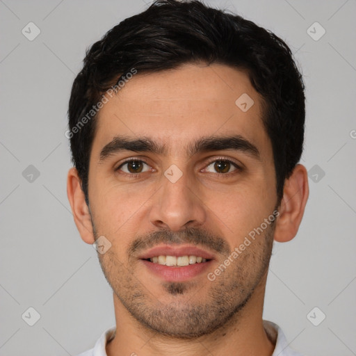 Joyful white young-adult male with short  black hair and brown eyes