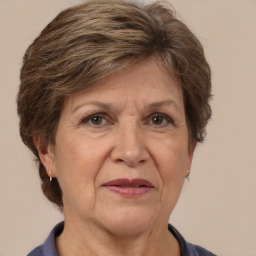 Joyful white middle-aged female with short  brown hair and brown eyes