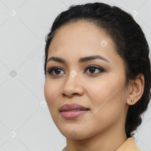 Joyful latino young-adult female with long  black hair and brown eyes