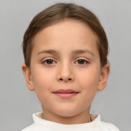 Joyful white child female with short  brown hair and brown eyes