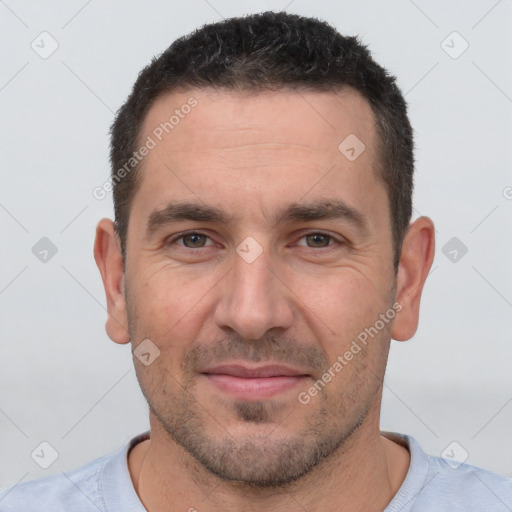 Joyful white adult male with short  brown hair and brown eyes