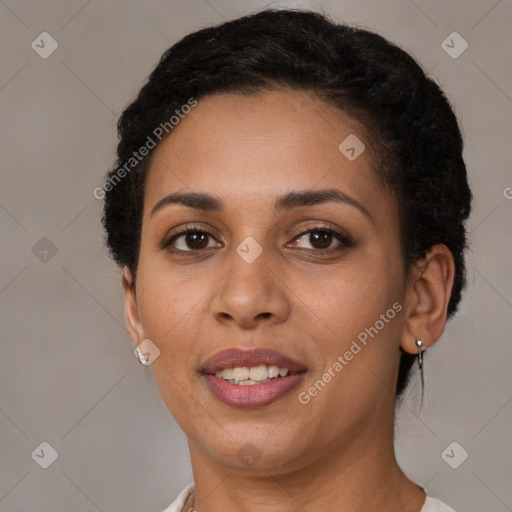 Joyful latino young-adult female with short  brown hair and brown eyes