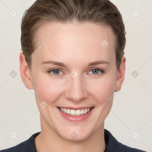 Joyful white young-adult female with short  brown hair and grey eyes