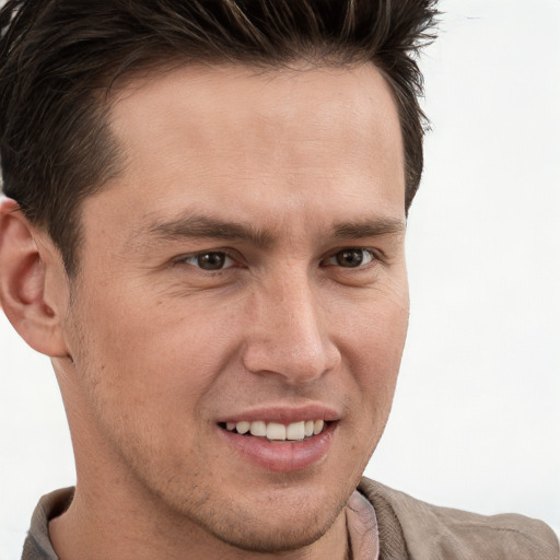 Joyful white adult male with short  brown hair and brown eyes