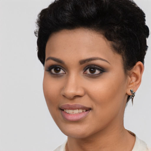 Joyful latino young-adult female with short  black hair and brown eyes