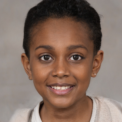 Joyful black child female with short  brown hair and brown eyes