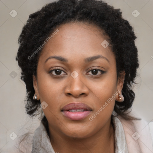 Joyful black young-adult female with long  brown hair and brown eyes