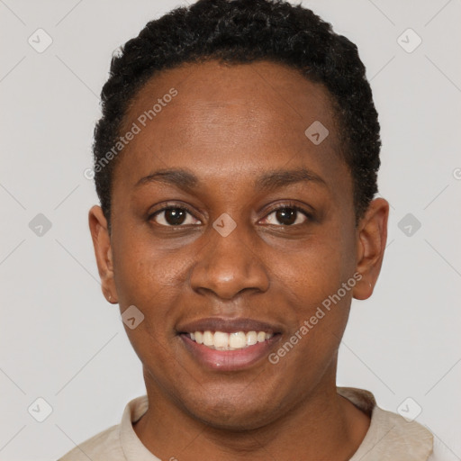 Joyful black young-adult female with short  brown hair and brown eyes