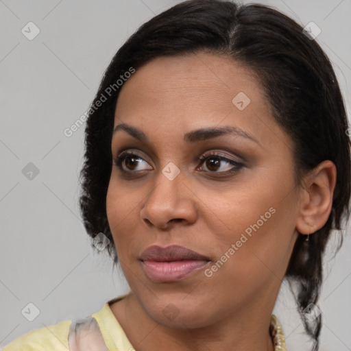 Joyful latino young-adult female with medium  brown hair and brown eyes