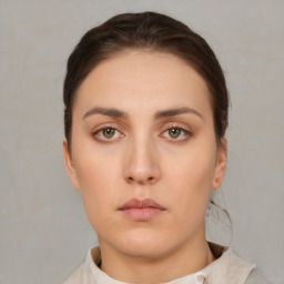 Neutral white young-adult female with short  brown hair and brown eyes