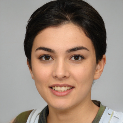 Joyful white young-adult female with medium  brown hair and brown eyes