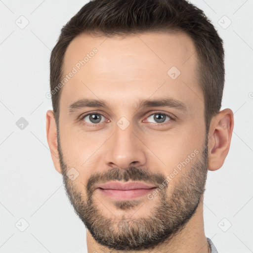 Joyful white young-adult male with short  brown hair and brown eyes