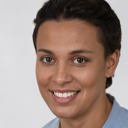 Joyful white young-adult female with short  brown hair and brown eyes