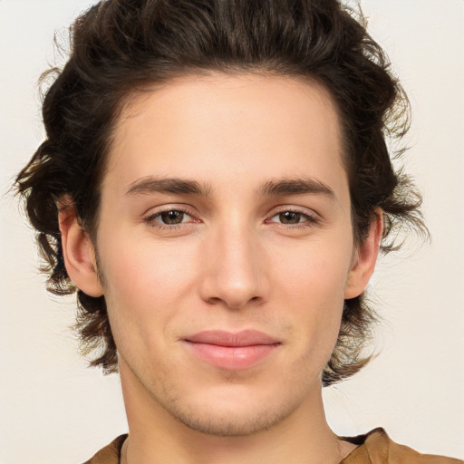 Joyful white young-adult male with medium  brown hair and brown eyes