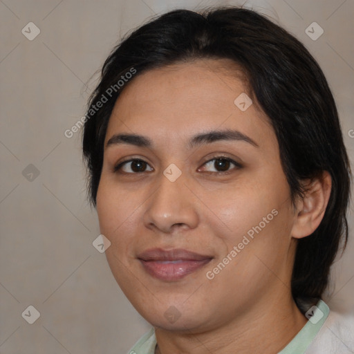 Joyful latino young-adult female with medium  brown hair and brown eyes