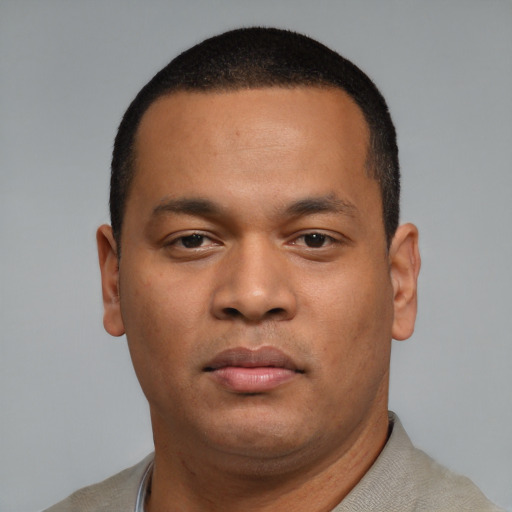 Neutral latino young-adult male with short  brown hair and brown eyes