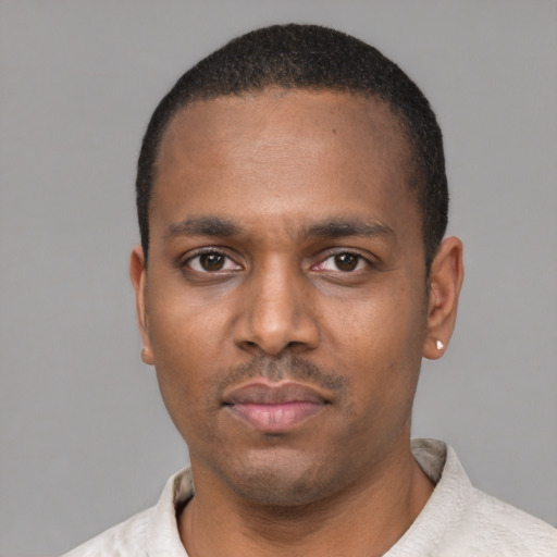 Neutral black young-adult male with short  black hair and brown eyes