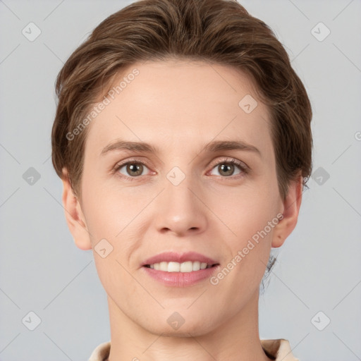 Joyful white young-adult female with short  brown hair and grey eyes