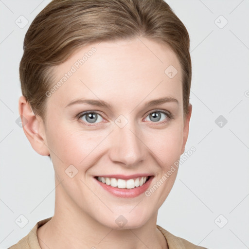 Joyful white young-adult female with short  brown hair and grey eyes