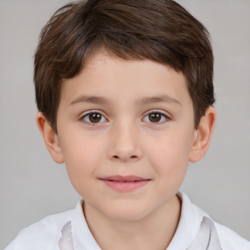 Joyful white child male with short  brown hair and brown eyes