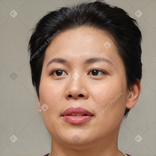 Joyful asian young-adult female with short  brown hair and brown eyes