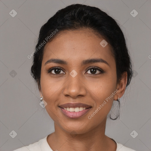 Joyful latino young-adult female with short  black hair and brown eyes