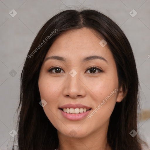 Joyful asian young-adult female with long  brown hair and brown eyes