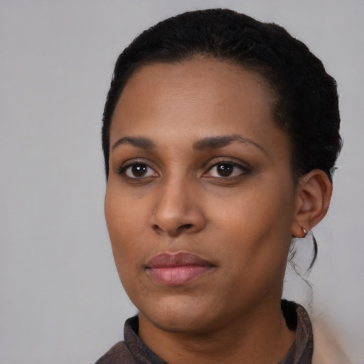 Neutral black young-adult female with short  black hair and brown eyes