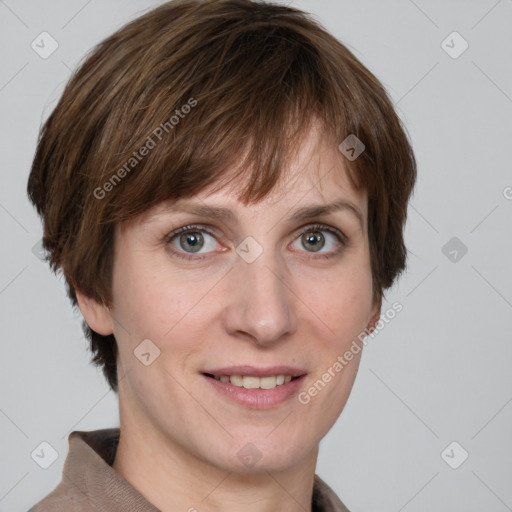 Joyful white adult female with short  brown hair and grey eyes