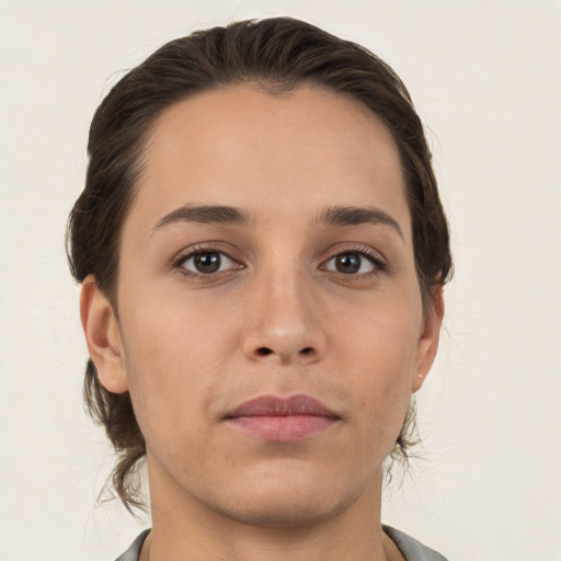 Neutral white young-adult female with medium  brown hair and brown eyes