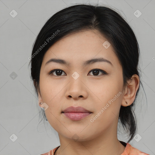 Joyful asian young-adult female with medium  black hair and brown eyes