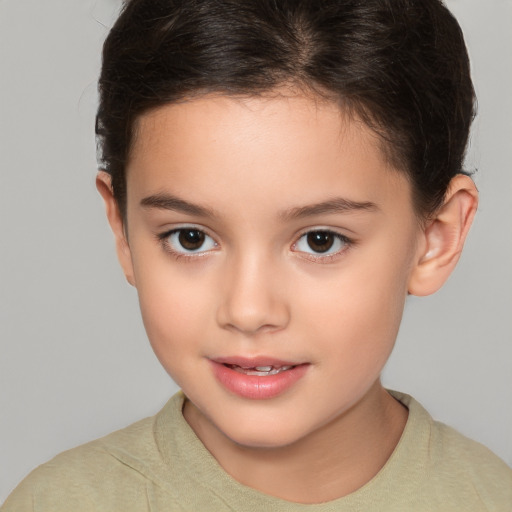 Joyful white child female with short  brown hair and brown eyes