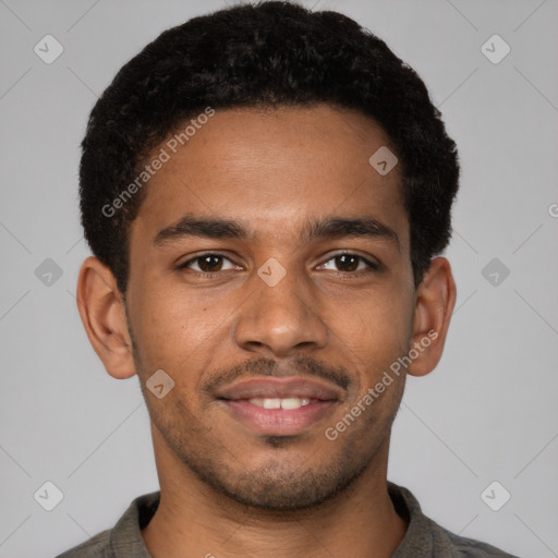 Joyful black young-adult male with short  brown hair and brown eyes