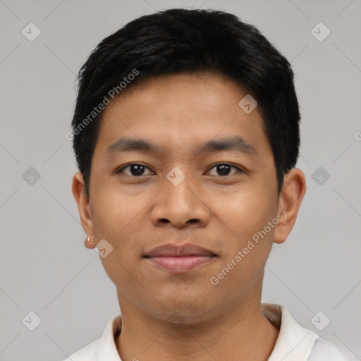 Joyful latino young-adult male with short  black hair and brown eyes