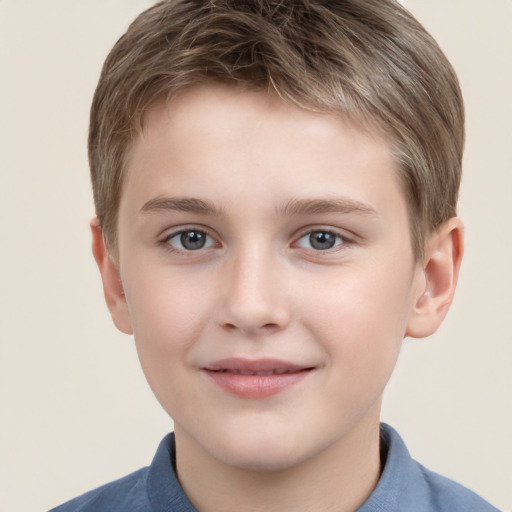 Joyful white child male with short  brown hair and grey eyes