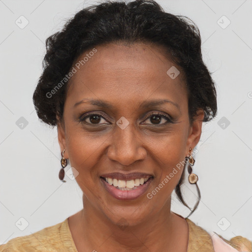 Joyful black adult female with short  brown hair and brown eyes