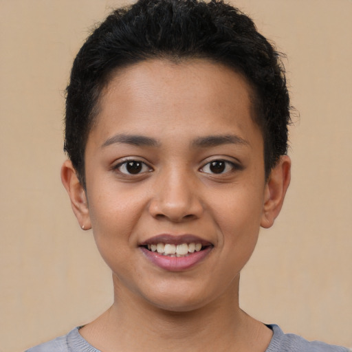 Joyful latino young-adult female with short  black hair and brown eyes