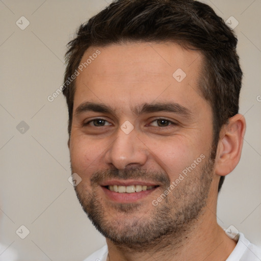 Joyful white young-adult male with short  brown hair and brown eyes