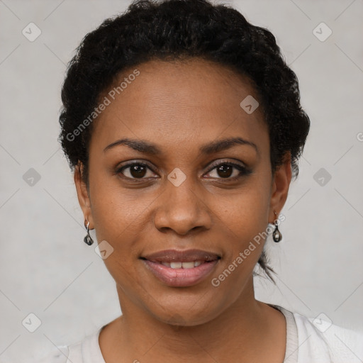 Joyful black young-adult female with short  brown hair and brown eyes