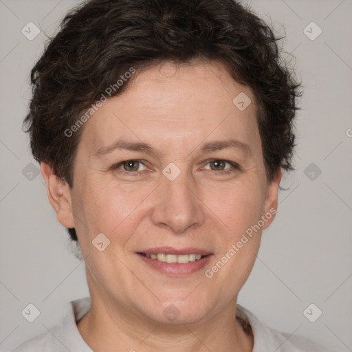 Joyful white adult female with short  brown hair and brown eyes