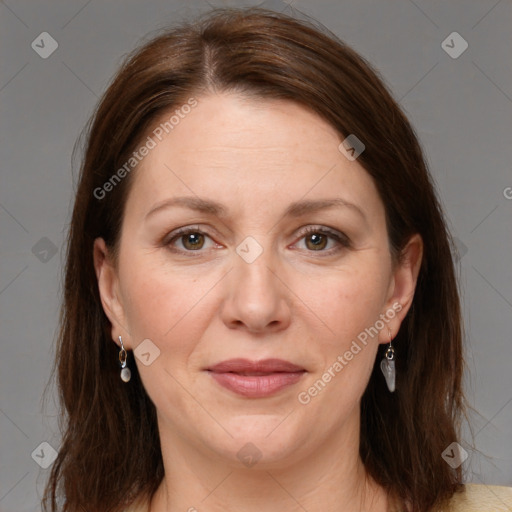 Joyful white adult female with medium  brown hair and grey eyes