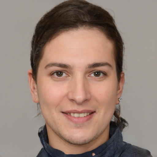 Joyful white young-adult male with medium  brown hair and brown eyes