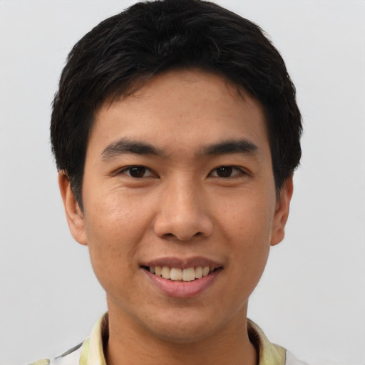 Joyful asian young-adult male with short  black hair and brown eyes