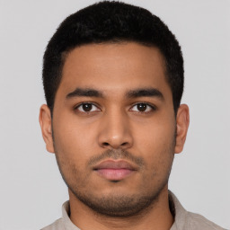 Neutral latino young-adult male with short  black hair and brown eyes